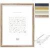 Cornice per foto Deknudt S244 in polistirolo con finitura legno e vetro trasparente, disponibile in oro, argento, bronzo o nero con bordo argento, formati 10x15, 13x18, 15x20, 18x24, 20x30, 21x29,7, 30x40 cm